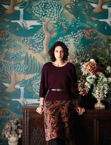 Melissa White standing on front of one of her paintings for Zoffany